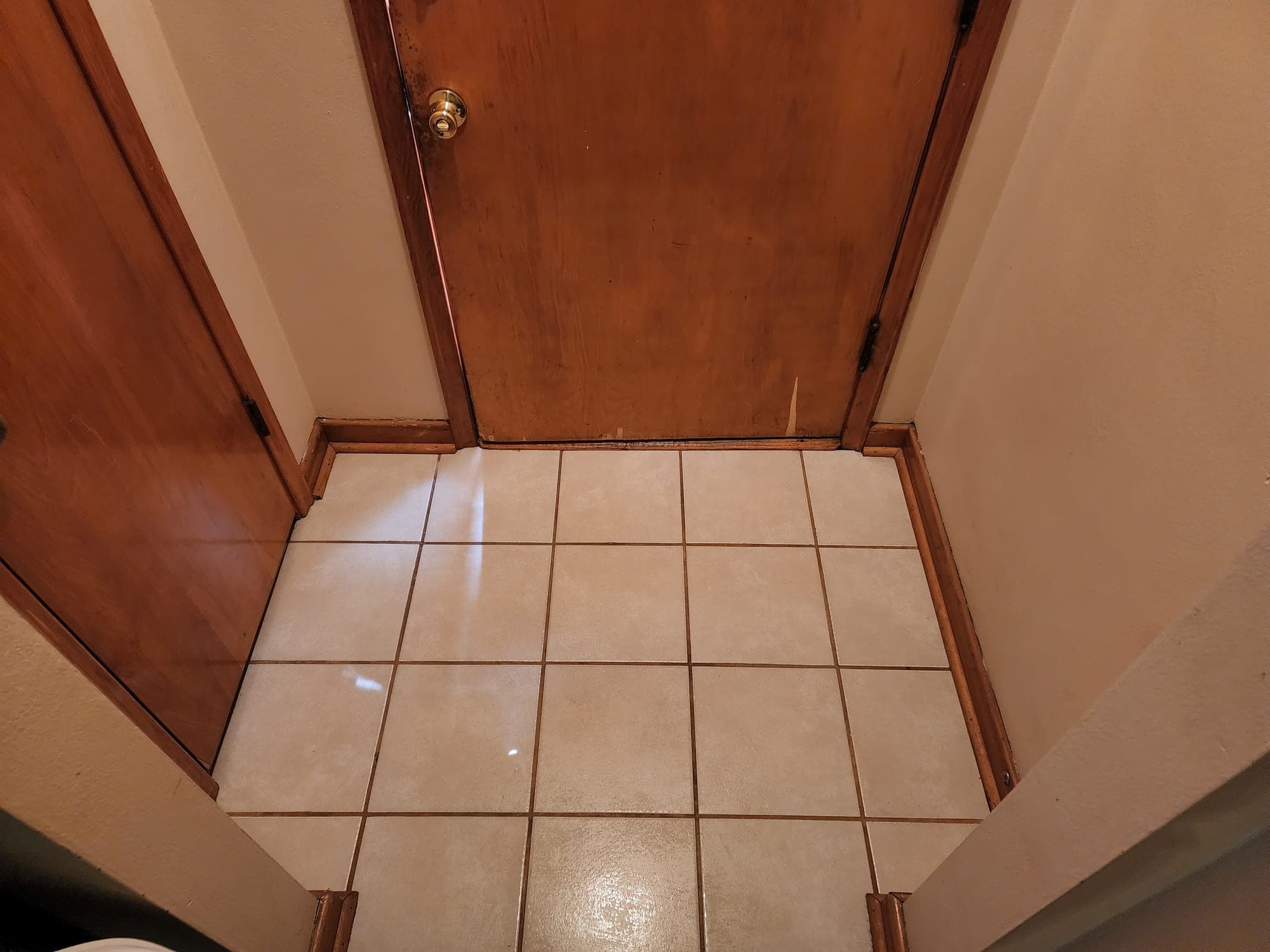 The same tile floor spotless after cleaning